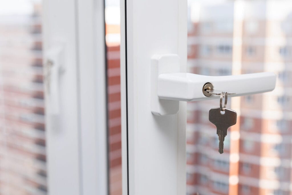 Plastic window closes with a key inserted into the keyhole. Protection for children.